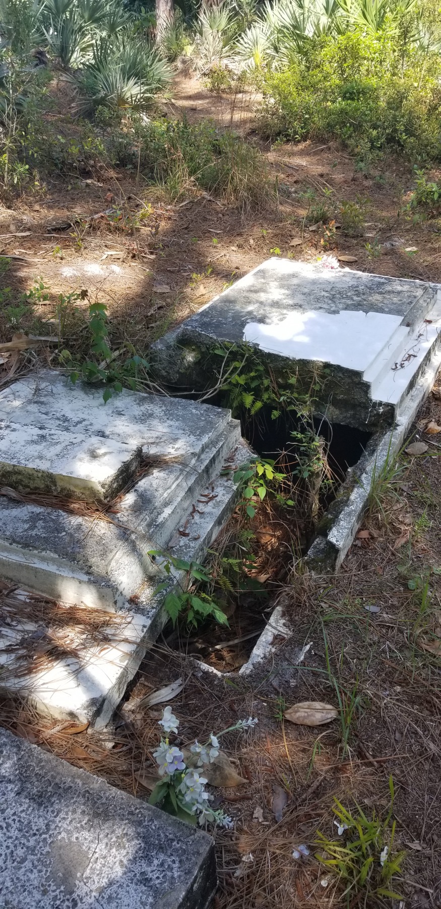 Damaged headstone at Oaklynn Cemetery in Volusia County, FL