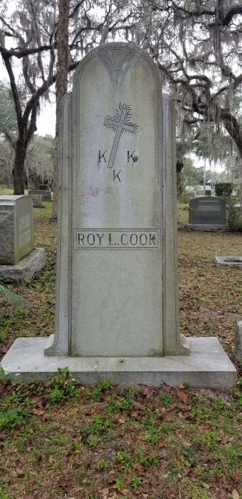 Headstone of Roy L. Cook DeLandHeadstone depicts a burning cross and denotes his membership in the KKK.