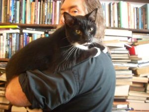 Abraxas Books owner Jim Sass and the world famous bookstore cat, Sterling.